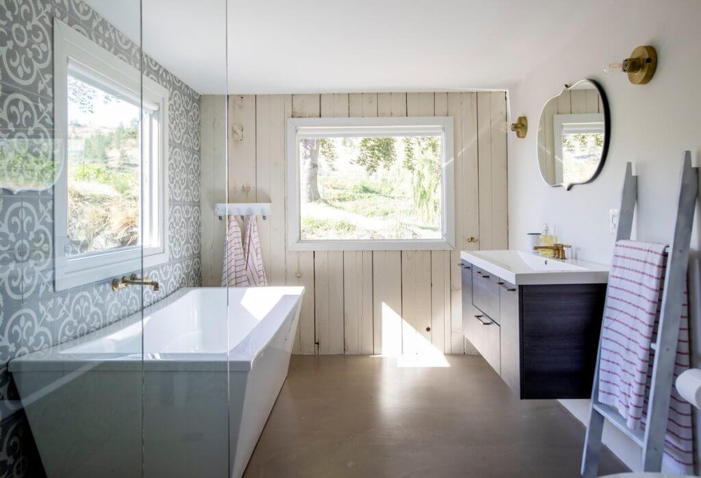 Large soaker tub and walk-in shower overlooking the vineyard.